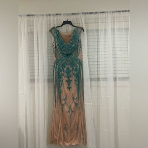 Worn only once. Beautiful dress in size 12.